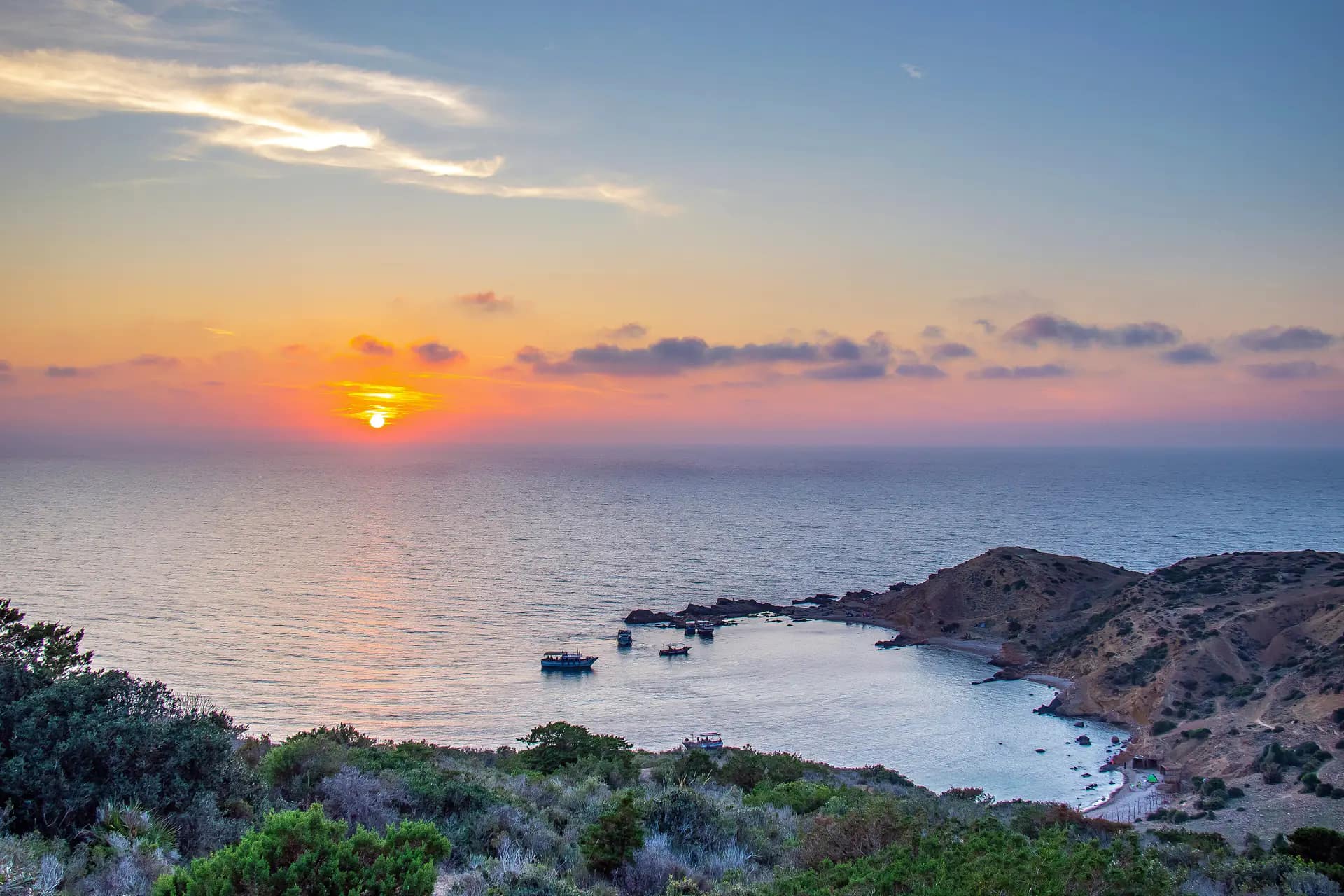 Sunset over the sea and a small cove on the Korbous coast