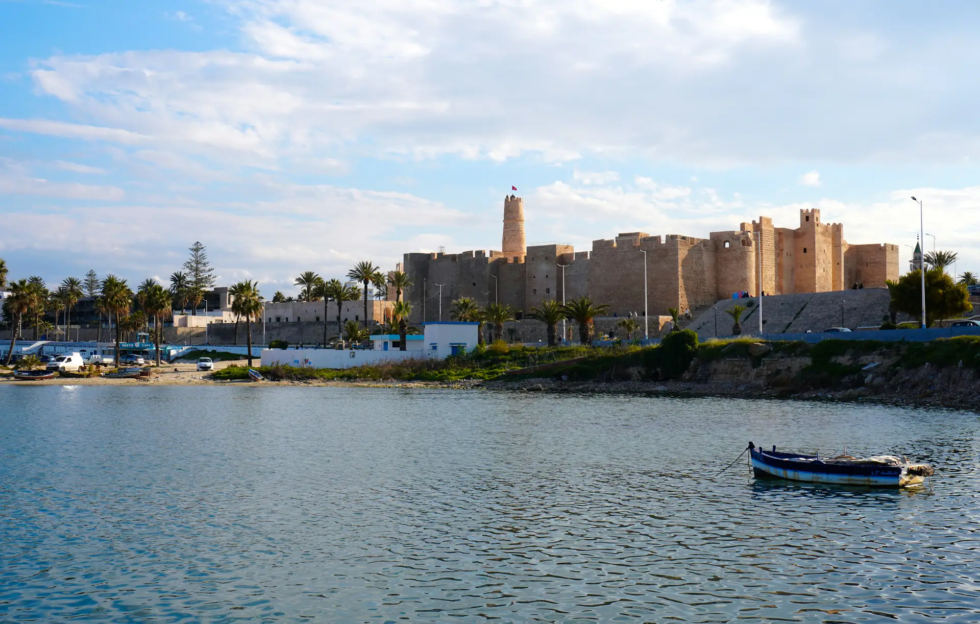 The Monastir ribat across the calm water of the harbour on a Sousse and Monastir day trip