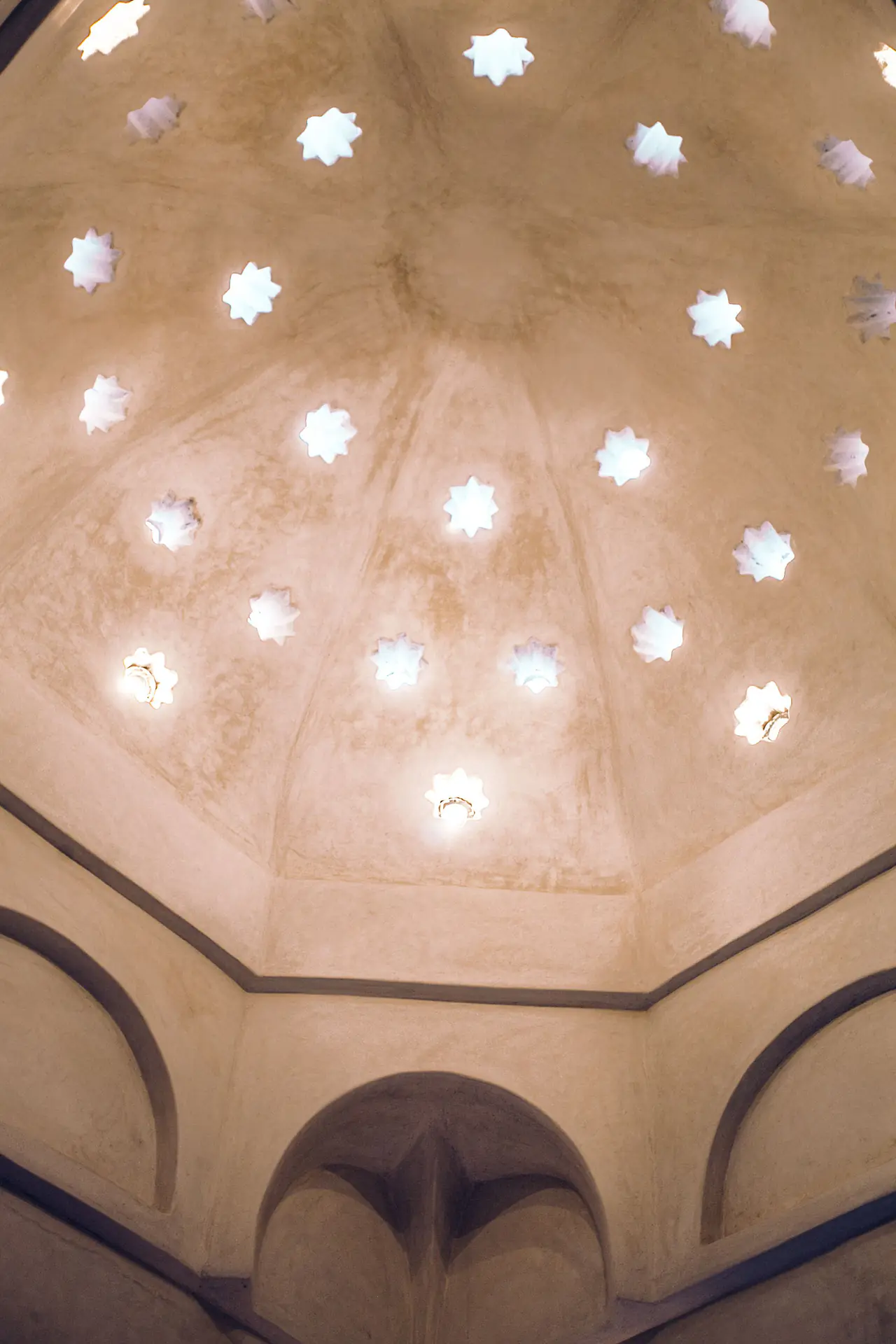 Star-shaped skylights in the domed ceiling of a traditional hammam