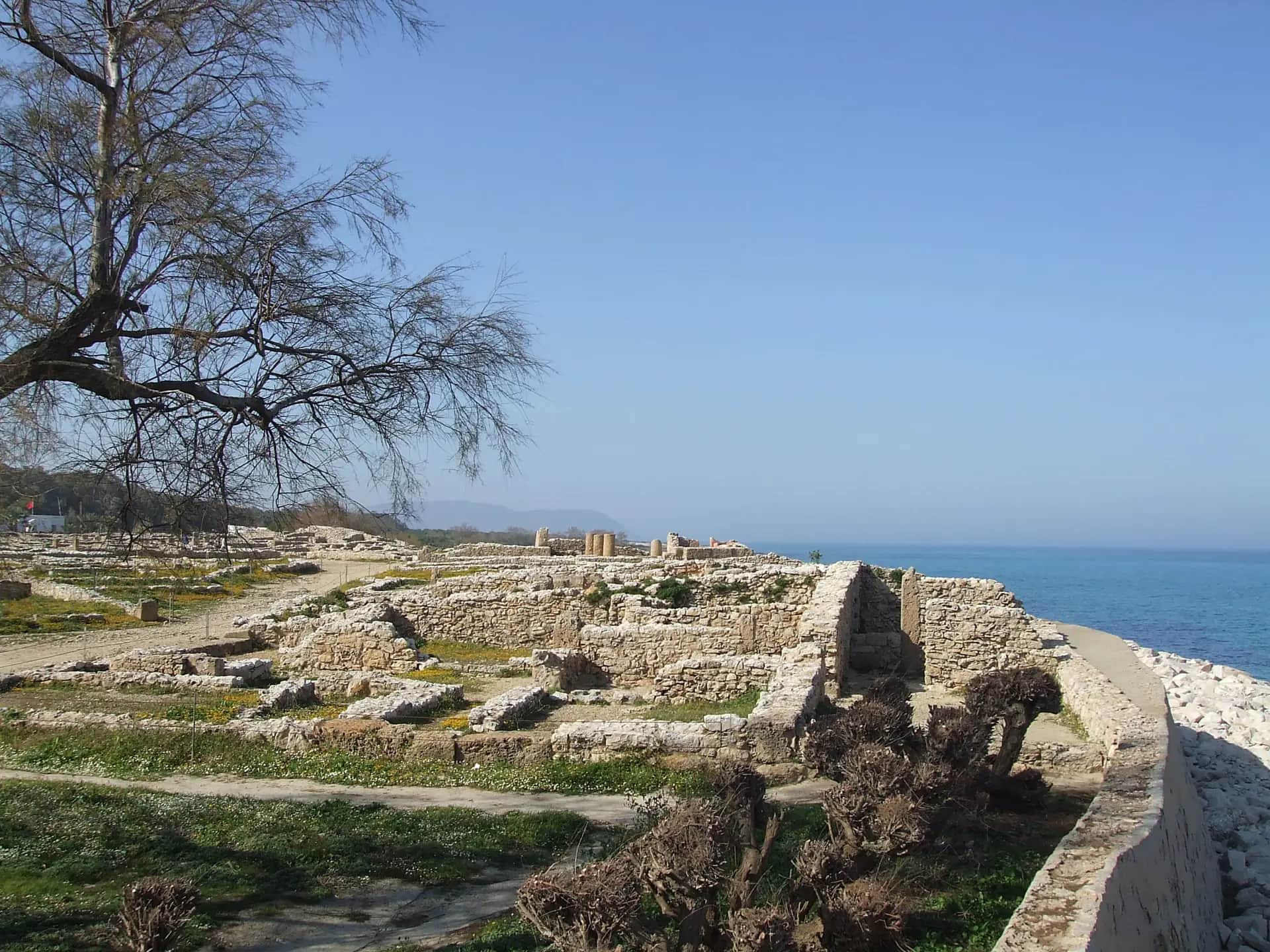 Stone foundations of the Punic town of Kerkouane with the sea behind